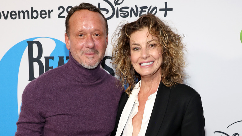 Faith Hill and Tim McGraw posing on step-and-repeat