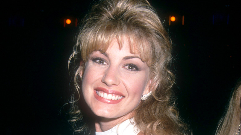 Faith Hill smiling in white dress in 1994