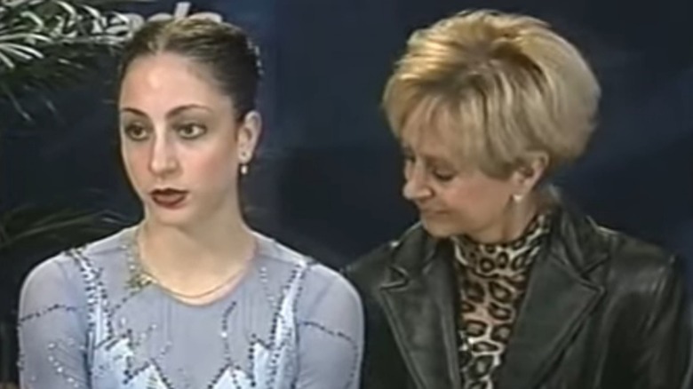 Deanna Stellato and her coach awaiting her score at 2000 Skate Canada International