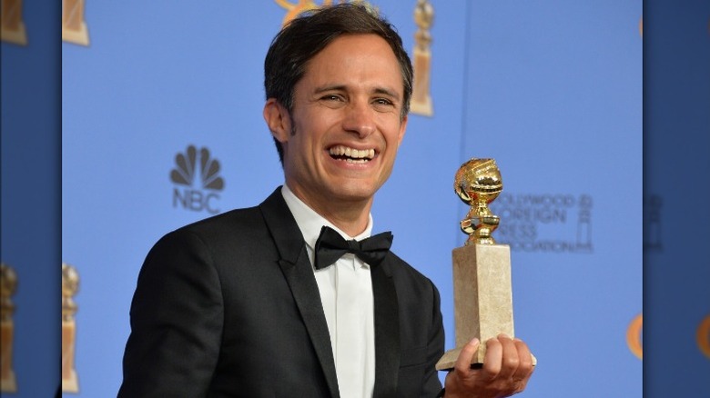 Gael García Bernal holding Golden Globe