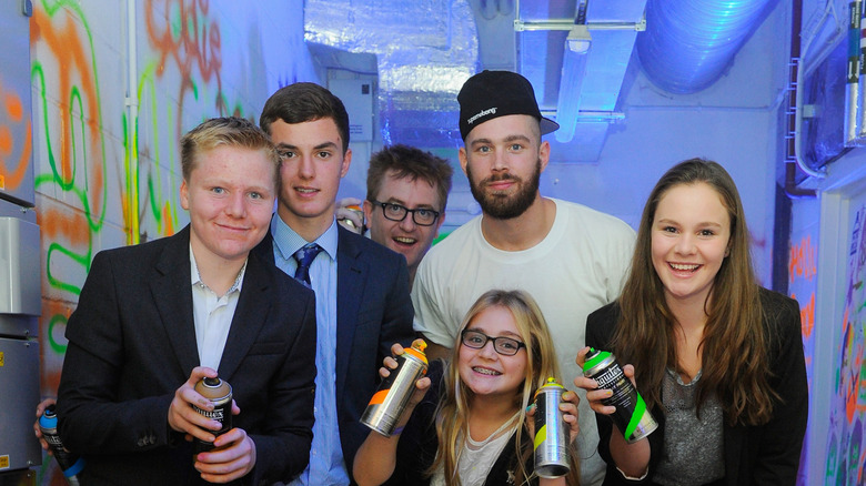 Louis Jensen, Jack Ramsay, Meghan Ramsay, Tilly Ramsay, and Holly Ramsay smiling at Gordon Ramsay's Union Street Cafe