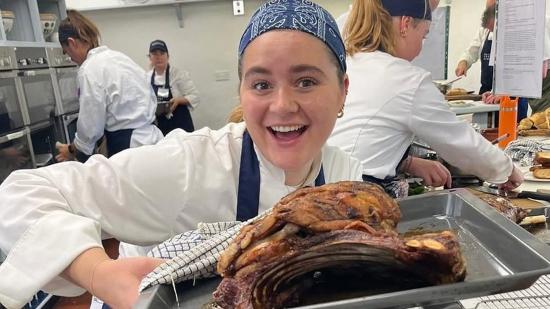Tilly Ramsay smiling at culinary school