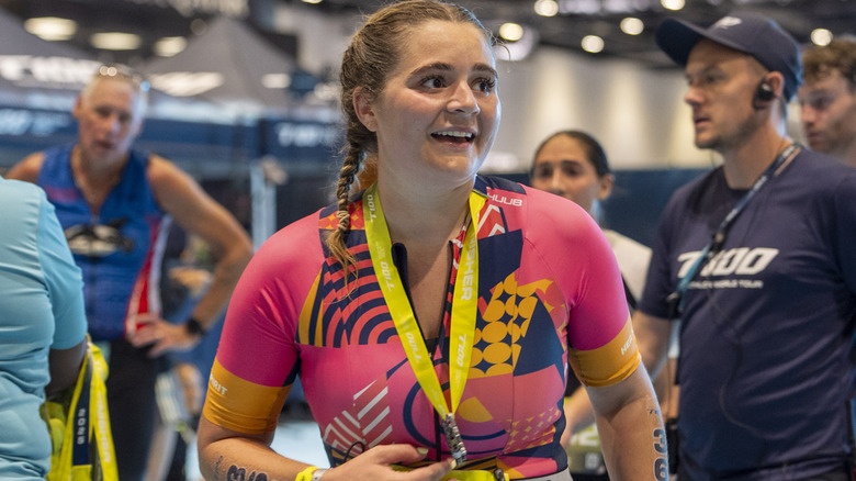 Tilly Ramsay smiling after finishing her T100 London Triathlon in 2025
