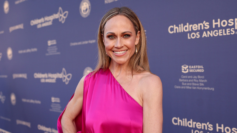 Nikki DeLoach wearing a pink dress and posing at a Children's Hospital Los Angeles gala in 2022