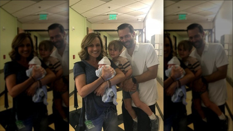 Nikki DeLoach and Ryan Goodell at the hospital with their sons after Bennett was born