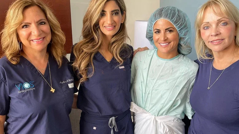 Alison Victoria with professionals at fertility clinic
