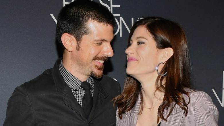 Jennifer Carpenter and Seth Avett smiling at each other at the 2019 "Fosse/Verdon" premiere