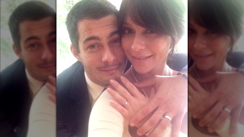 Brian Hallisay and Jennifer Love Hewitt taking a selfie at their wedding