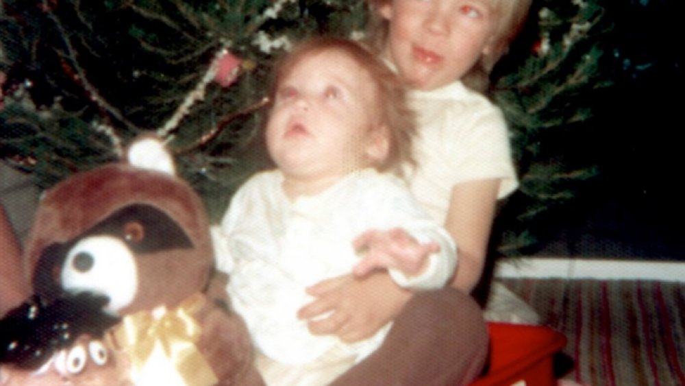 Jewel as a baby in a wagon with her brother