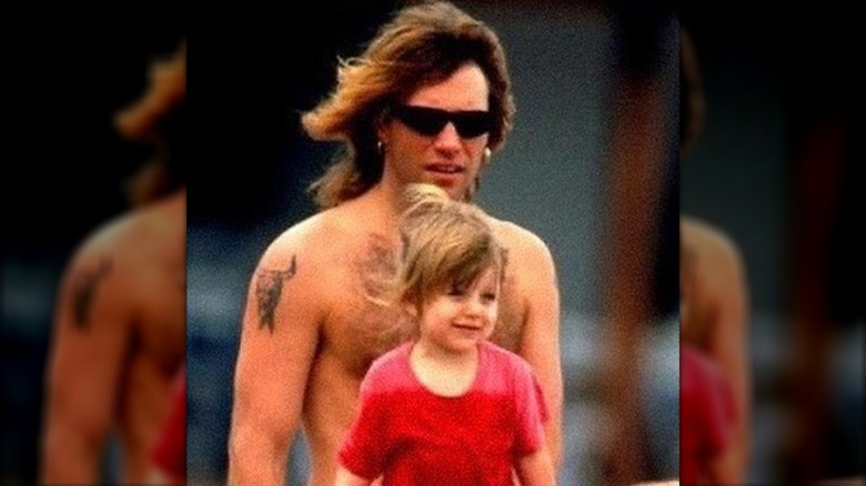 Jon Bon Jovi sitting with his daughter, Stephanie Rose Bongiovi