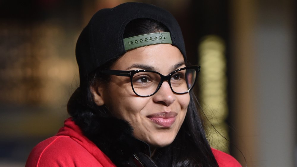 Singer Jordin Sparks with glasses and cap