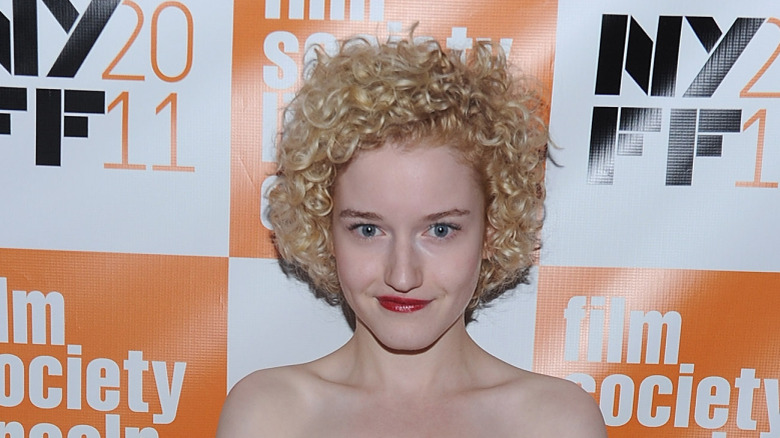 Julia Garner smiling at a screening of Martha Marcy May Marlene