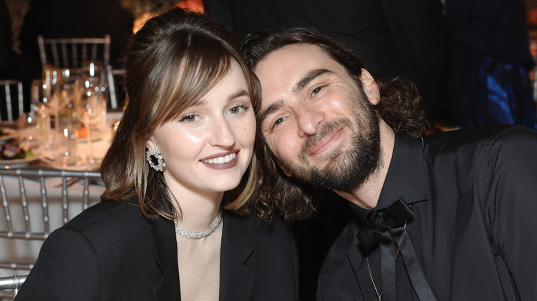 Kaitlyn Dever and Ethan Dawes smiling at the Vanity Fair Oscar Party