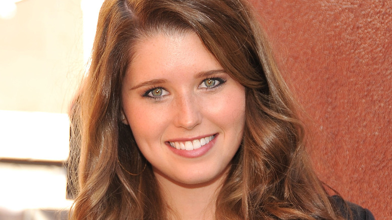 young Katherine Schwarzenegger smiling