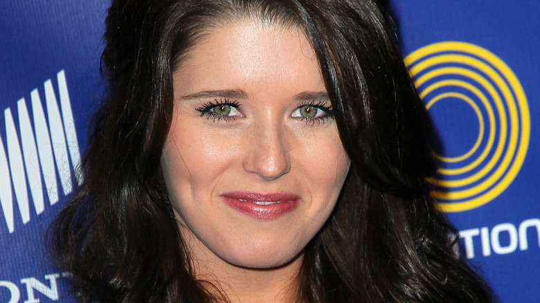 young Katherine Schwarzenegger smiling