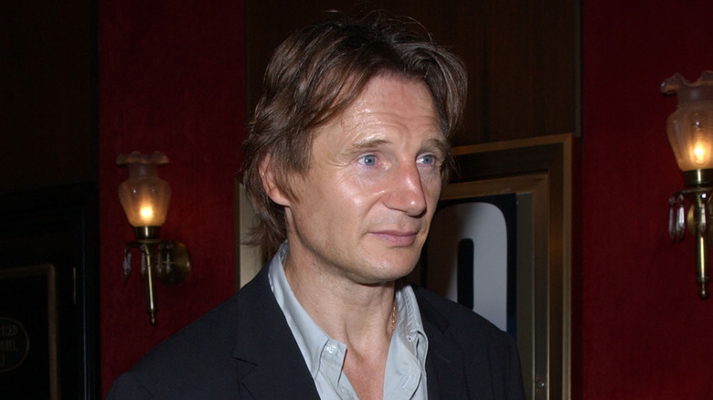 Liam Neeson with shirt unbuttoned