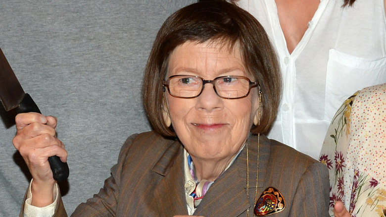 Linda Hunt smiling and posing