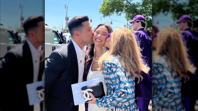 Lola Consuelos with her parents at NYU graduation in 2023