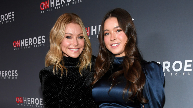 Kelly Ripa and Lola Consuelos posing at an event in 2019
