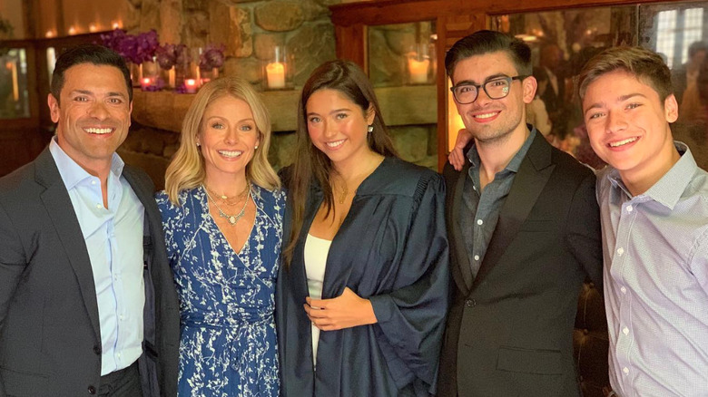 Lola Consuelos celebrating her high school graduation with her family in 2019