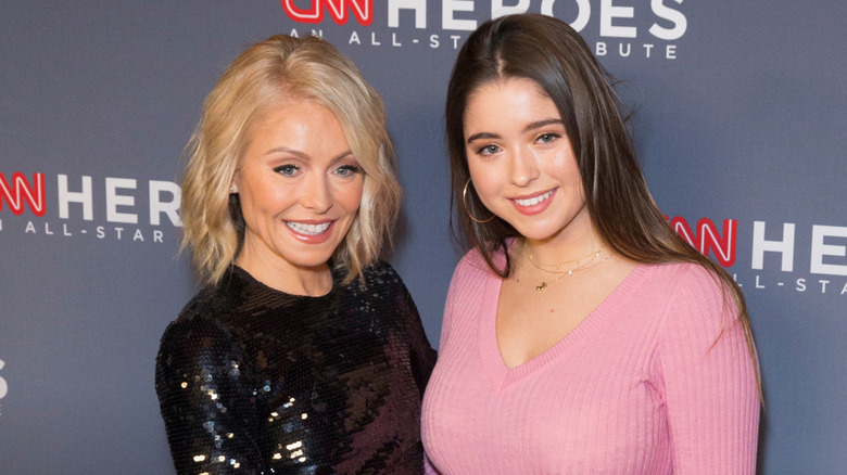 Kelly Ripa and Lola Consuelos posing at an event in 2017