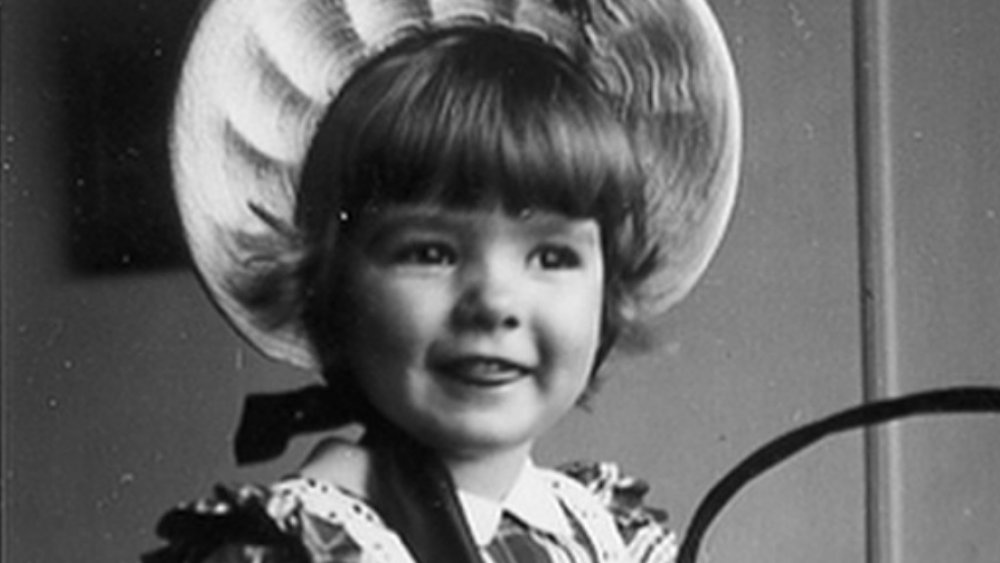 Martha Stewart as a young girl wearing a hat