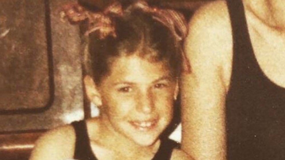 Mayim Bialik as a young girl with ribbons in her hair