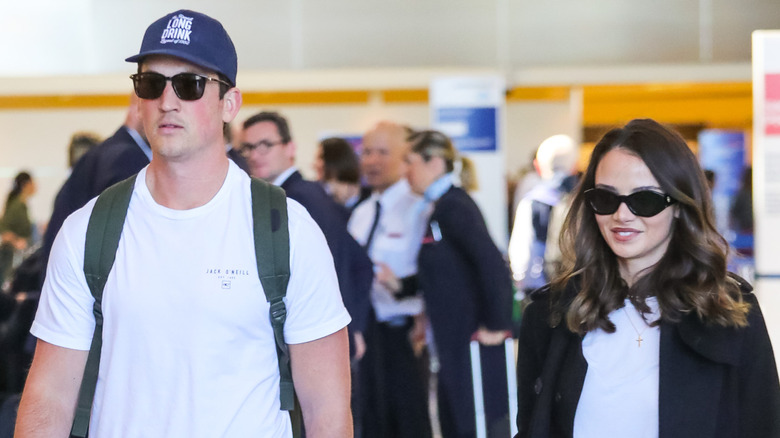 Keleigh Sperry and Miles Teller walking through an airport in 2020