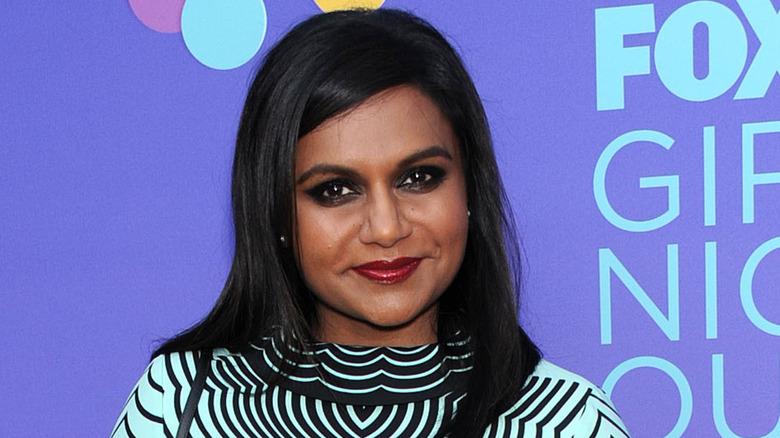 Mindy Kaling poses at an event
