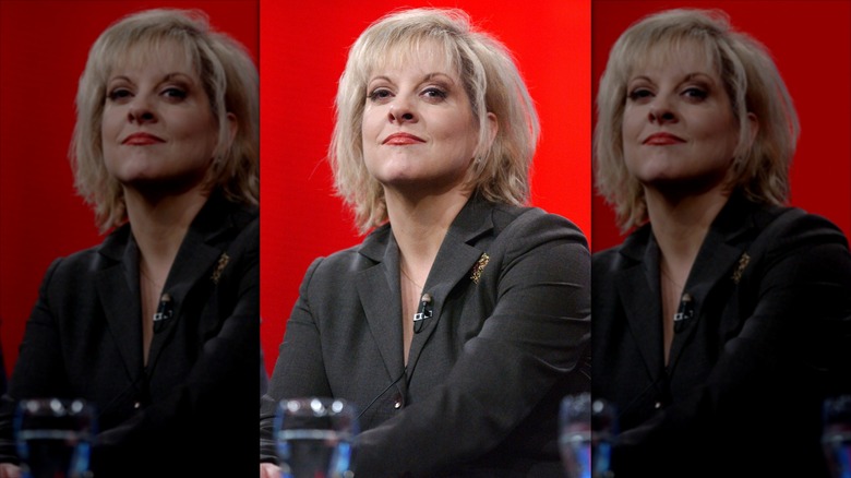 Nancy Grace at an HLN press conference in 2005 against a red background