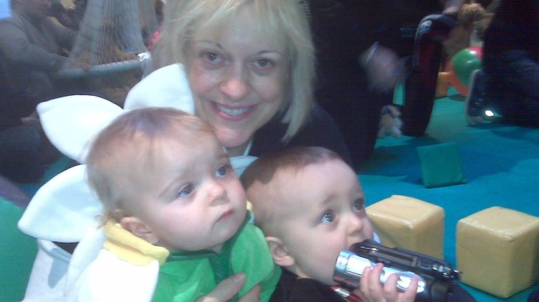 Nancy Grace smiling with Lucy Elizabeth and John David Linch as babies.