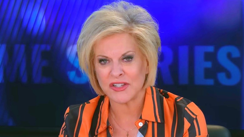 Nancy Grace on a November 2025 episode of "Crime Stories" in an orange and black striped shirt