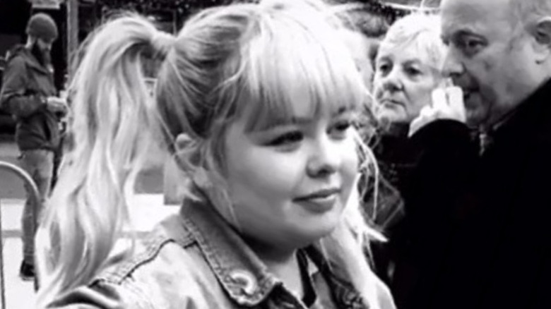 Closeup of young Nicola Coughlan in black and white