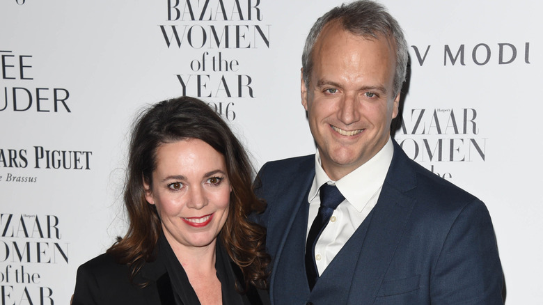 Olivia Colman and Ed Sinclair posing together at an event in 2016
