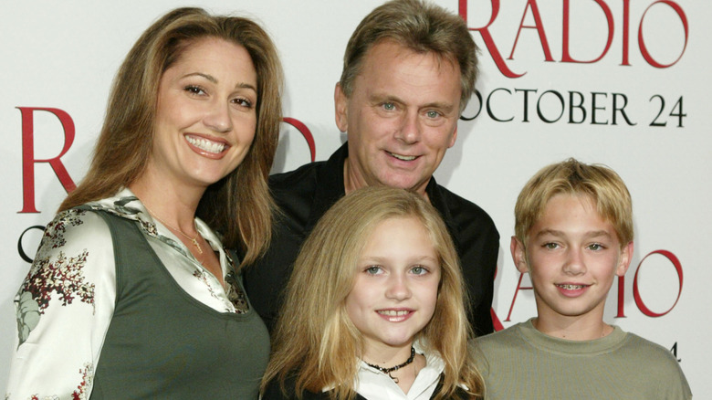 Lesly Brown, Pat, Maggie, and Patrick Sajak smiling at a red-carpet event