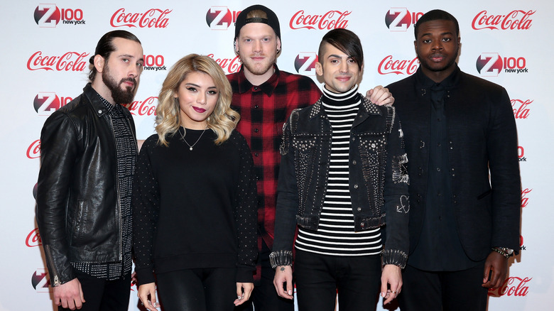 Pentatonix posing on step-and-repeat