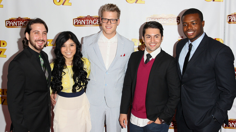 Pentatonix posing on step-and-repeat