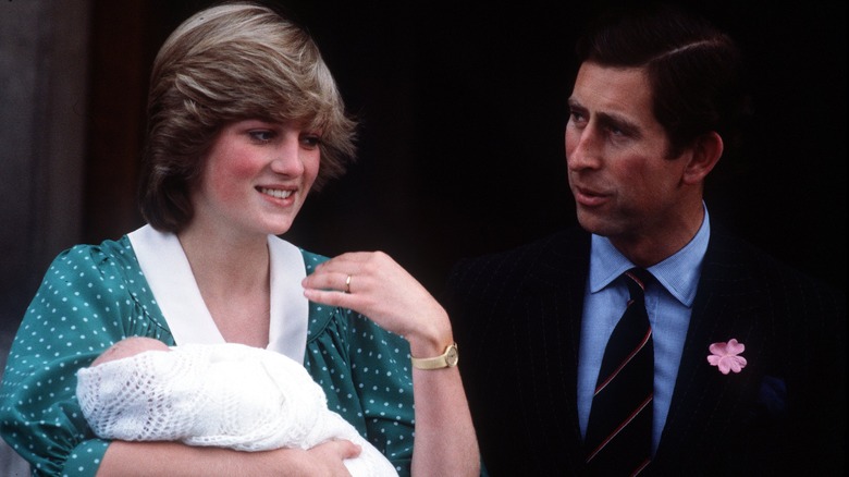 Princess Diana holding baby Prince William with King Charles