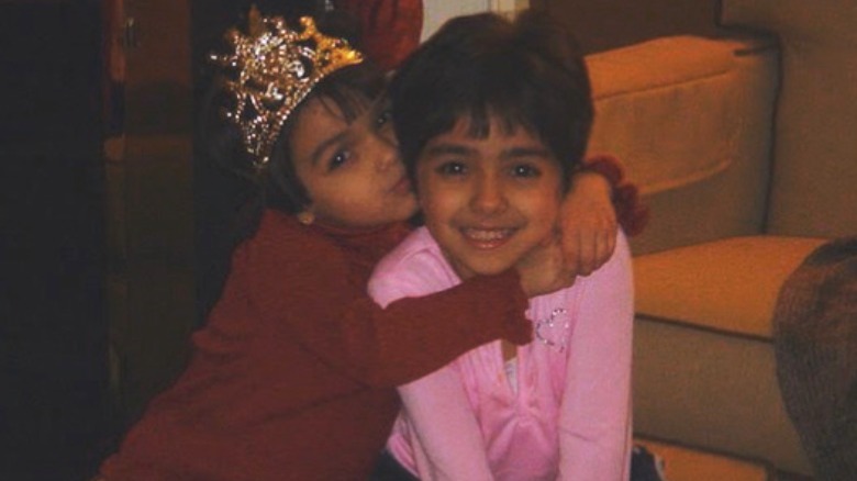 Rachel Zegler with her sister wearing a crown
