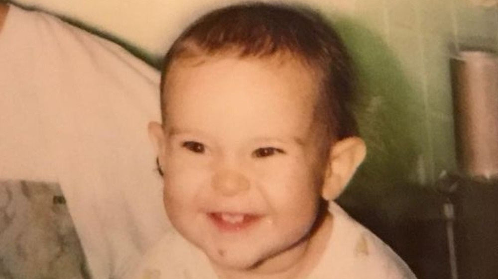 Rumer Willis as a baby, smiling