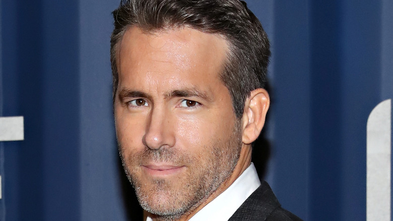 Ryan Reynolds posing with a smirk