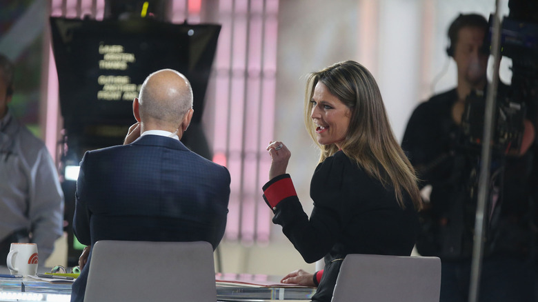 Savannah Guthrie and Matt Lauer from behind on set of "Today" sitting in front of teleprompter