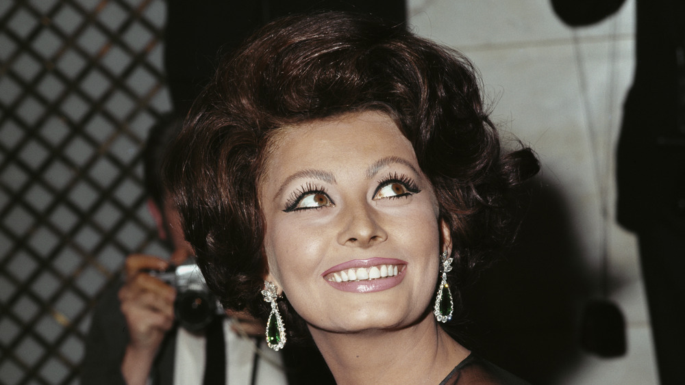 Sophia Loren smiling widely at a press conference