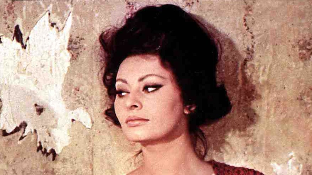 Sophia Loren in an archival movie photo, next to an actor