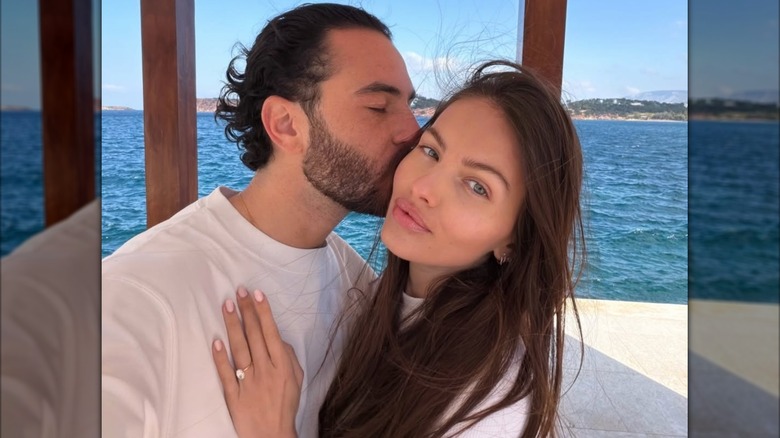 Ben Attal kissing his fiancee Thylane Blondeau in 2026