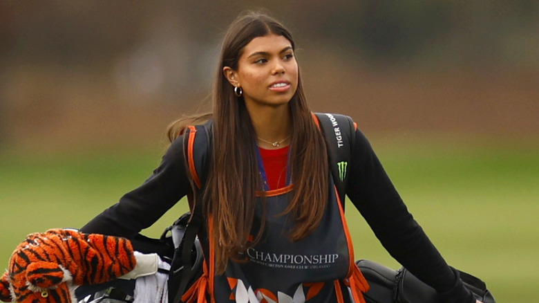 Sam Woods walking across golf course