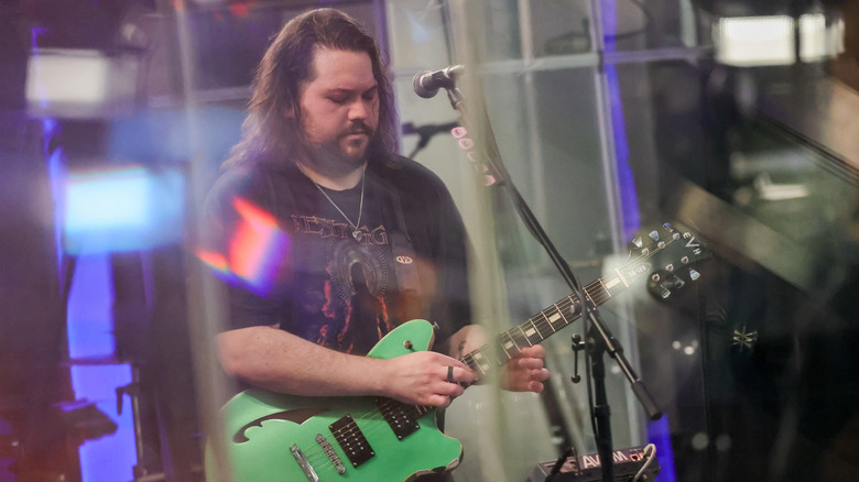 Wolfgang Van Halen playing guitar in a SiriusXM studio in 2025