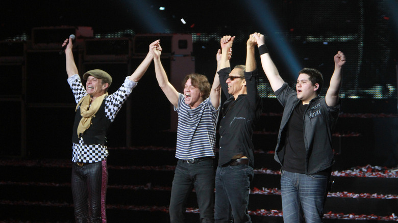 Wolfgang Van Halen taking a bow with David Lee Roth, Eddie Van Halen, and Alex Van Halen