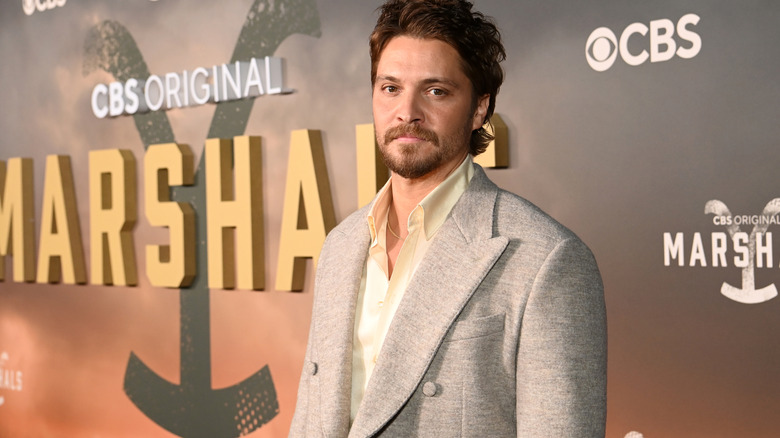 Luke Grimes waist-up at a red carpet event