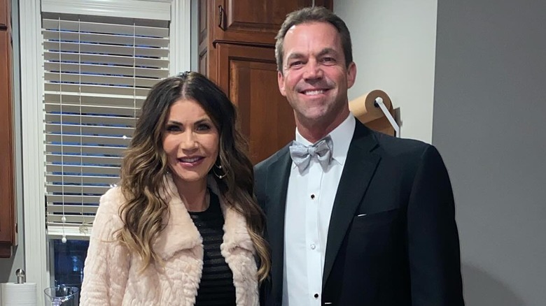 Kristi Noem and Bryon Noem smiling for the camera in their kitchen